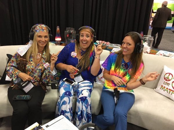 NCTM guests in groovy 60s clothes listening to music