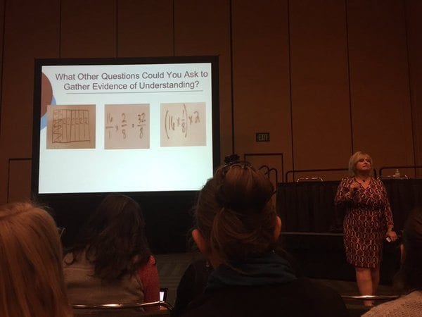 sherry parish speaking at NCTM in front of a powerpoint presentation slide | what other questions could you ask to gather evidence of understanding?